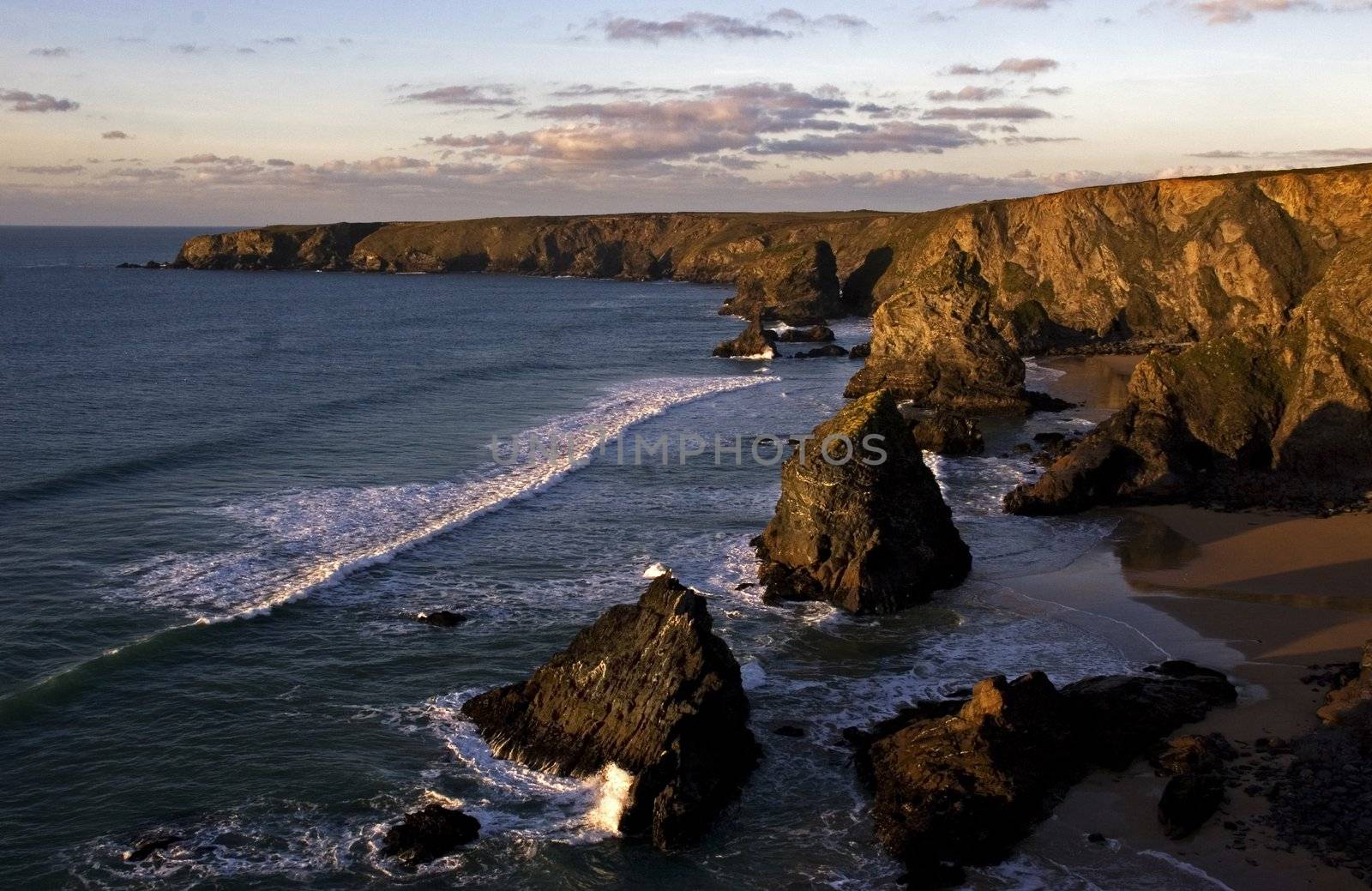 Bedruthan Steps, Cornwall, at sunset by olliemt