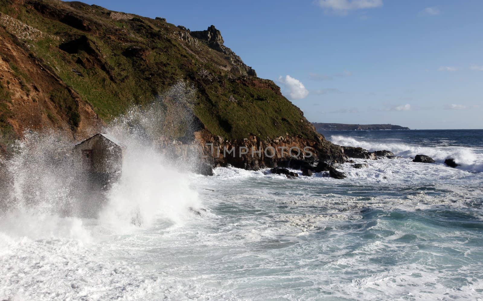 Fishing hut being battered by waves by olliemt