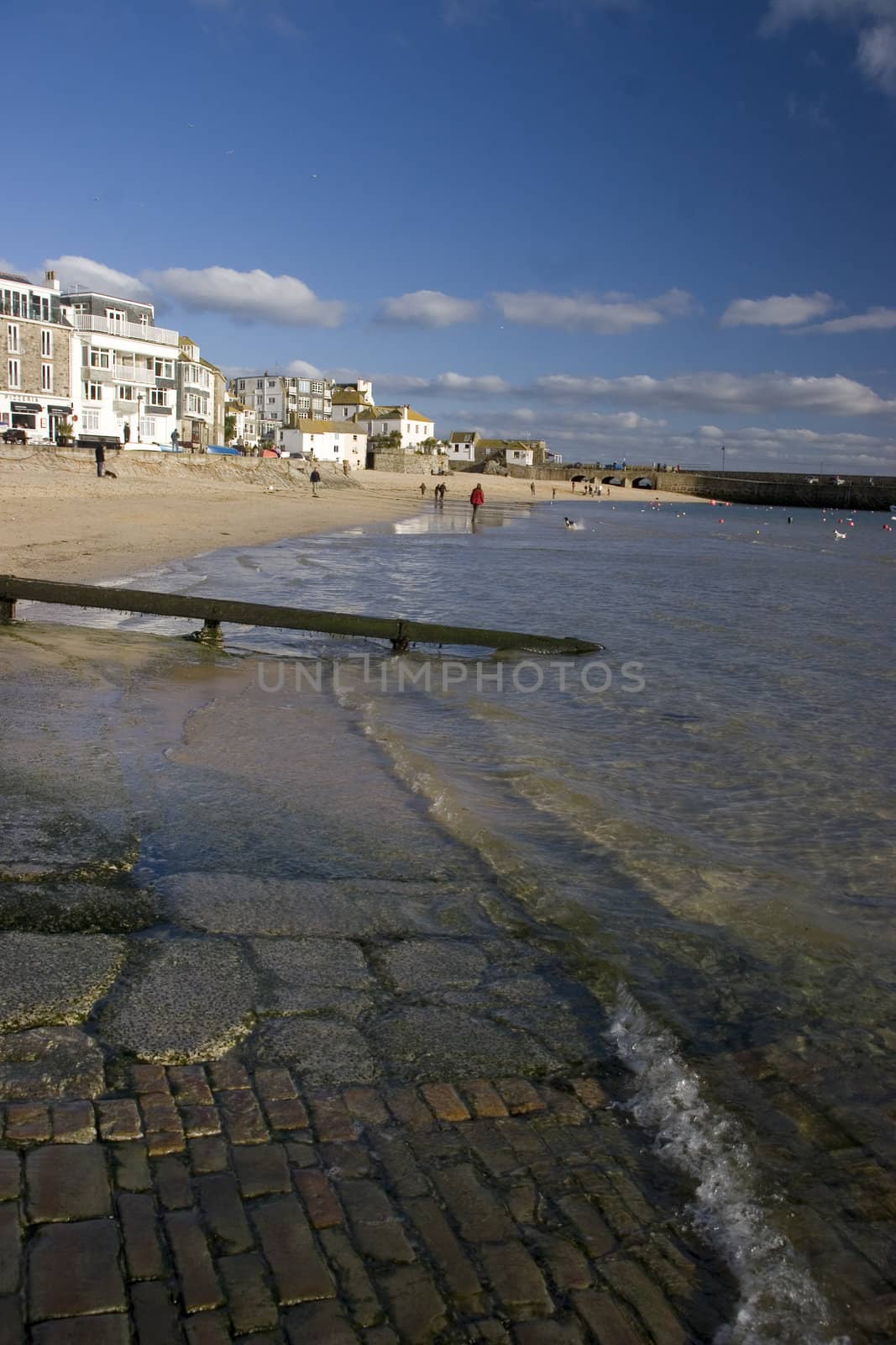 Water lapping up onto the beach at St Ives