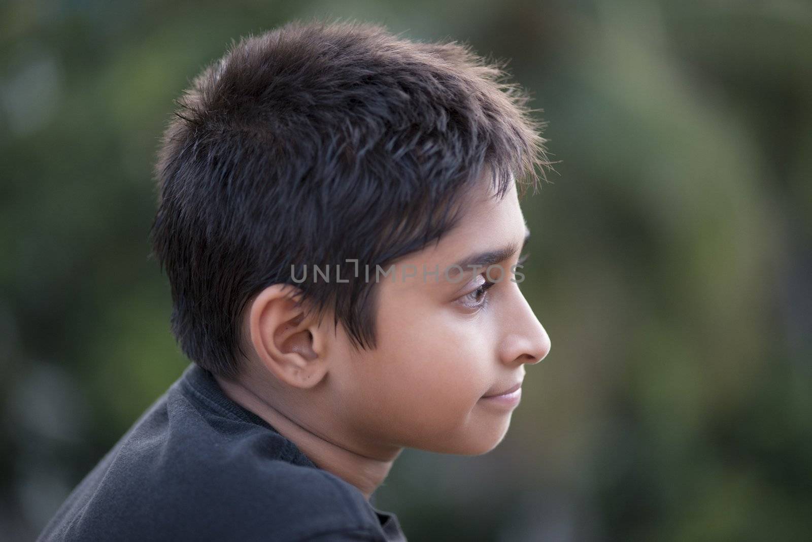 Handsome Indian toddler standing outdoor smiling