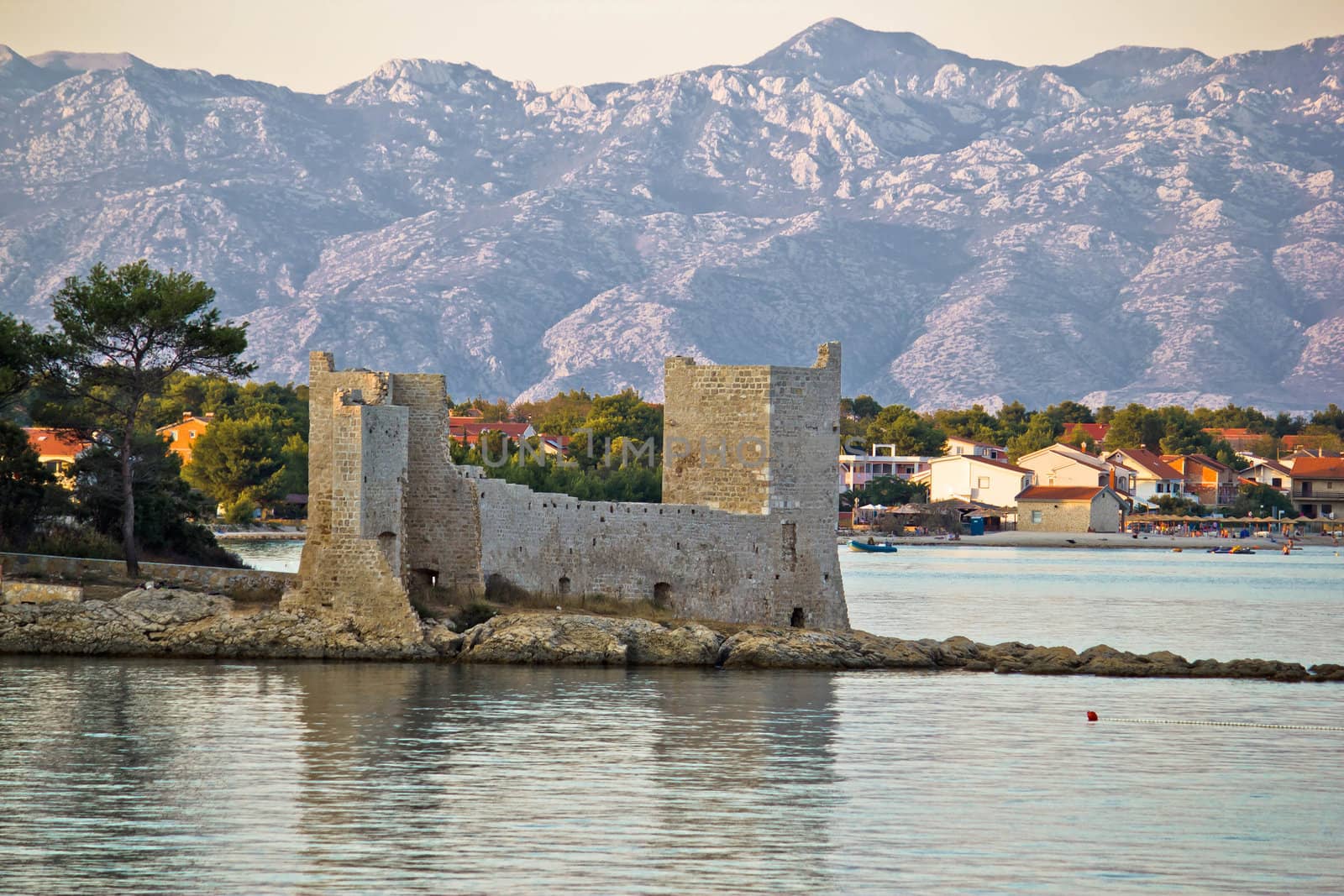 Island of Vir fortress ruins with Velebit mountain in background, Dalmatia, Croatia
