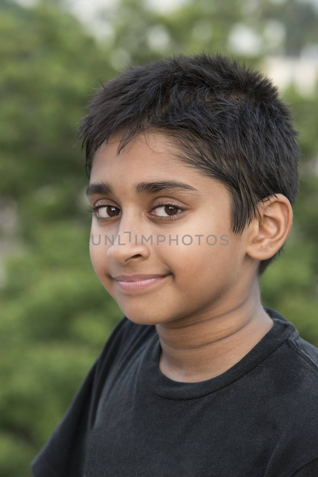 Handsome Indian toddler standing outdoor smiling