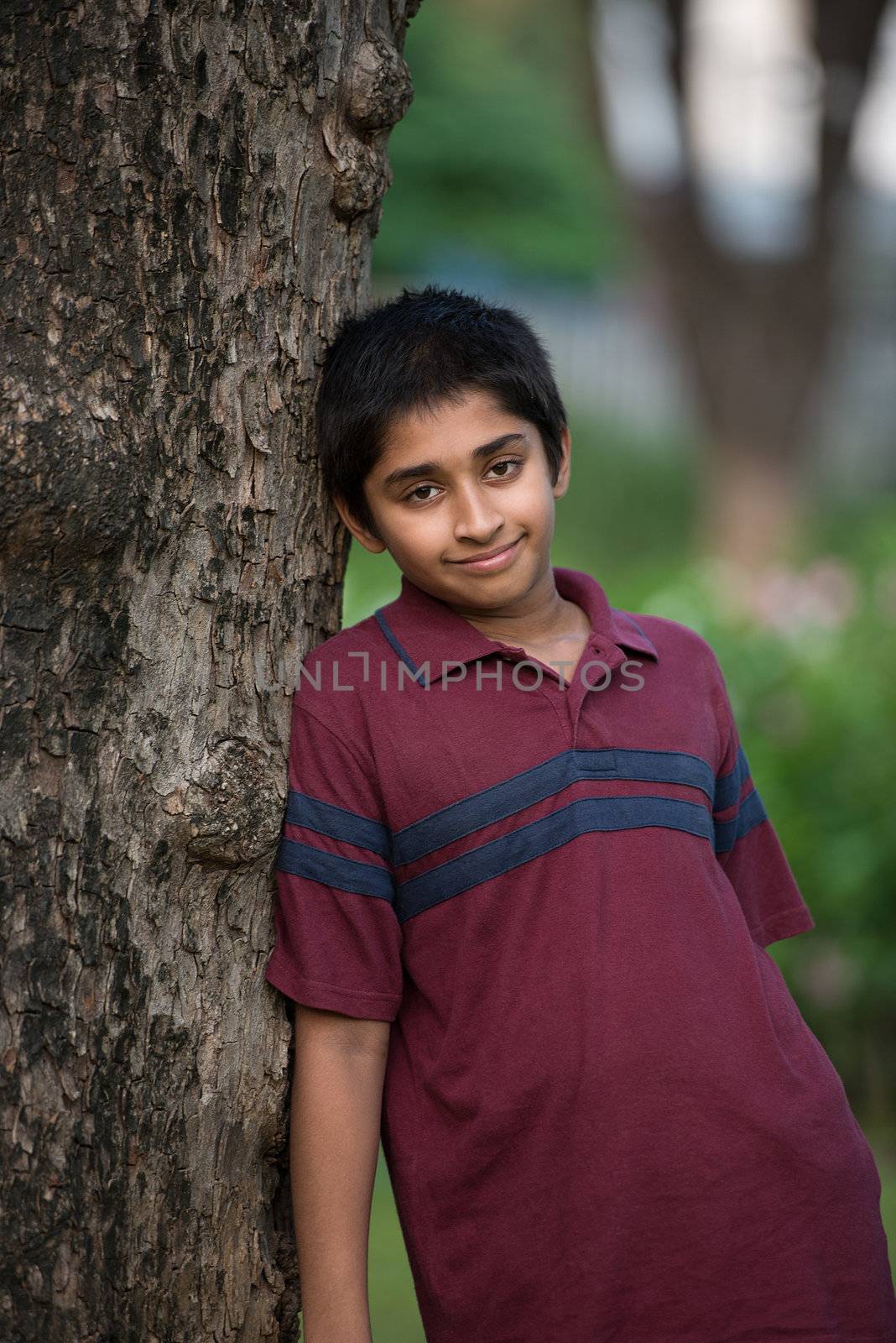 Handsome Indian toddler standing outdoor smiling