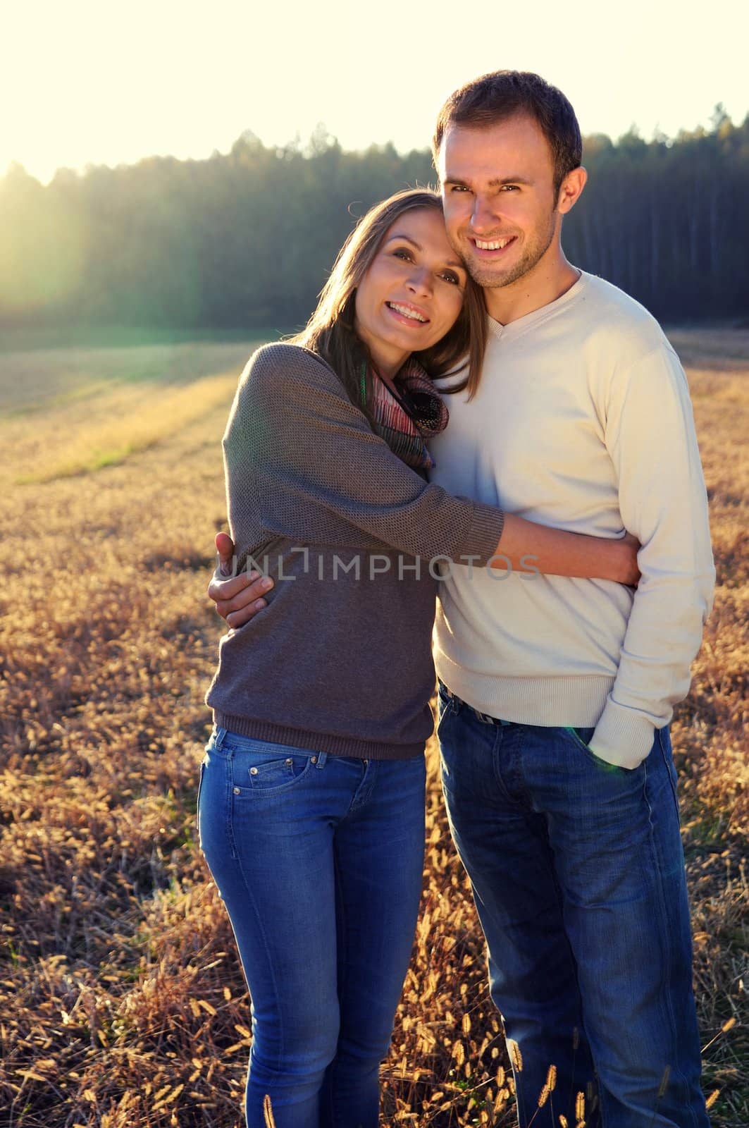 Young hugging couple in fall by mmajk