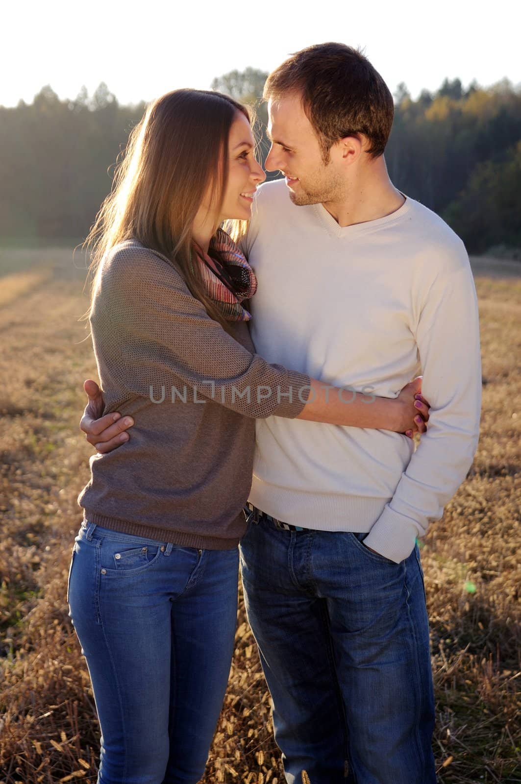 Young hugging couple in fall by mmajk