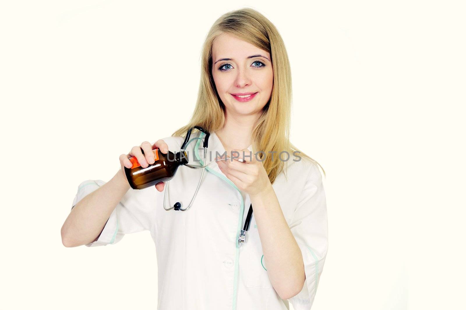 Female doctor pouring syrup for patient by mmajk