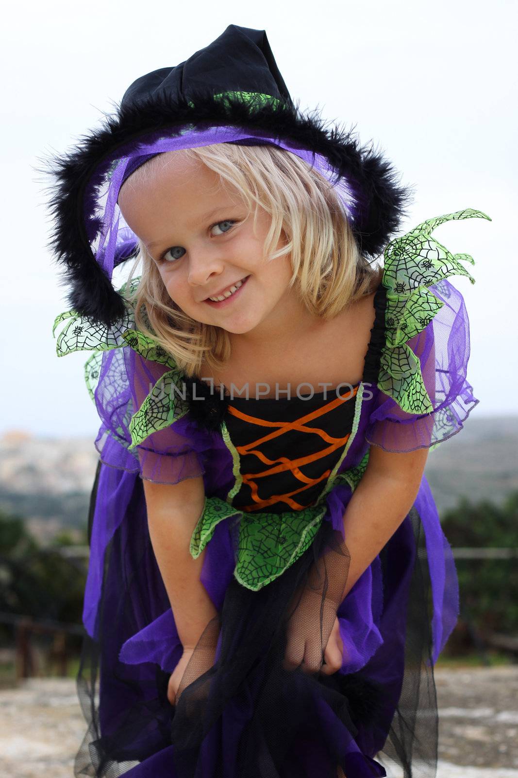 Girl dressed up for Halloween or Carnical in a witch outfit