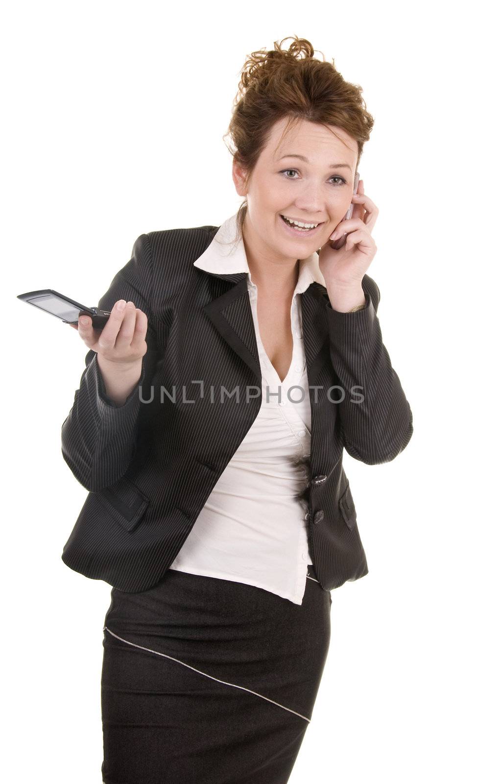 Attractive business women with two phones isolated on white