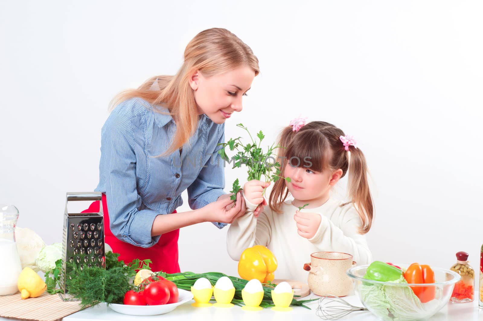Mother and daughter cooking together, help children to parents