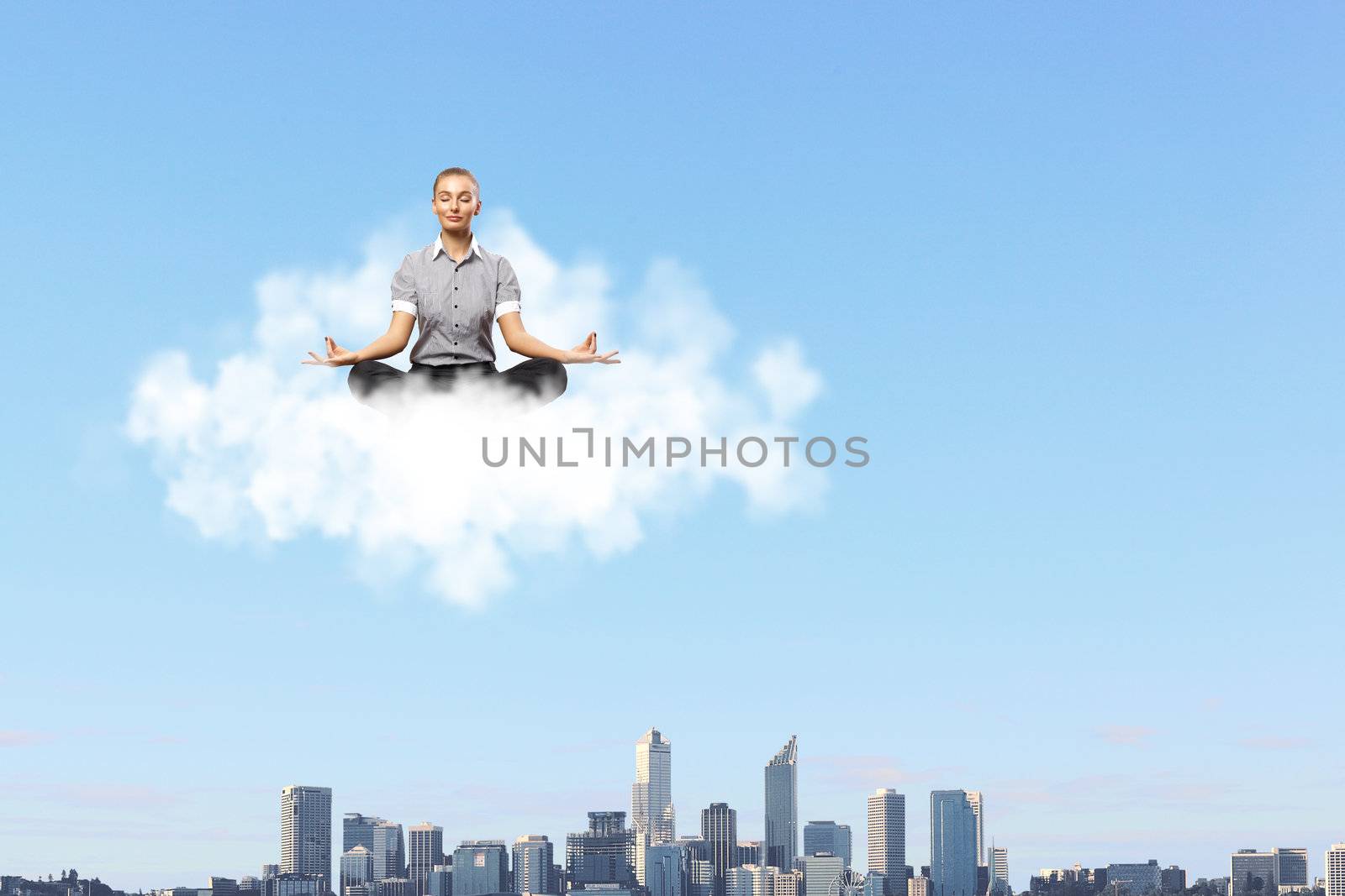 Businessman meditating sitting on the white cloud