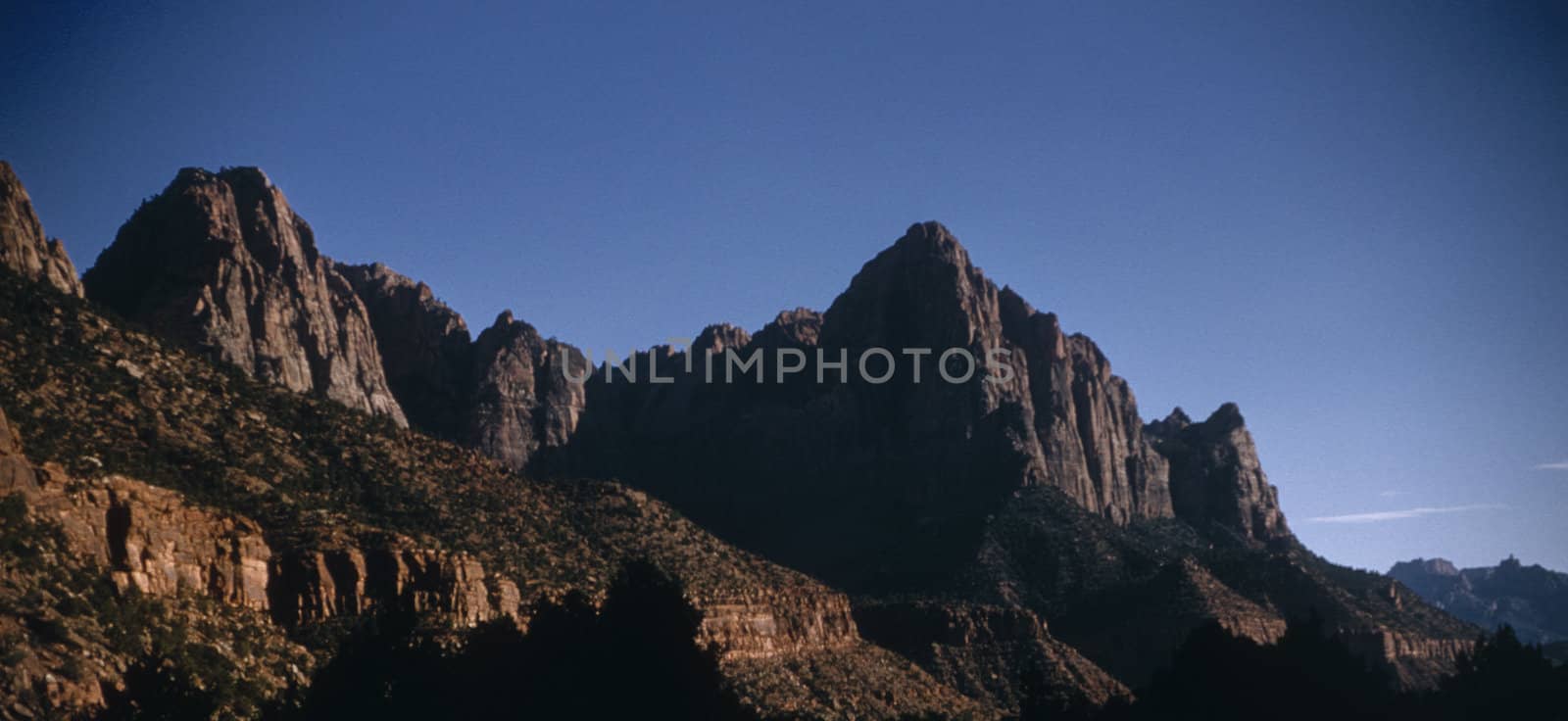 Vertical cliffs and rocky mountains in Zion National Park, Utah