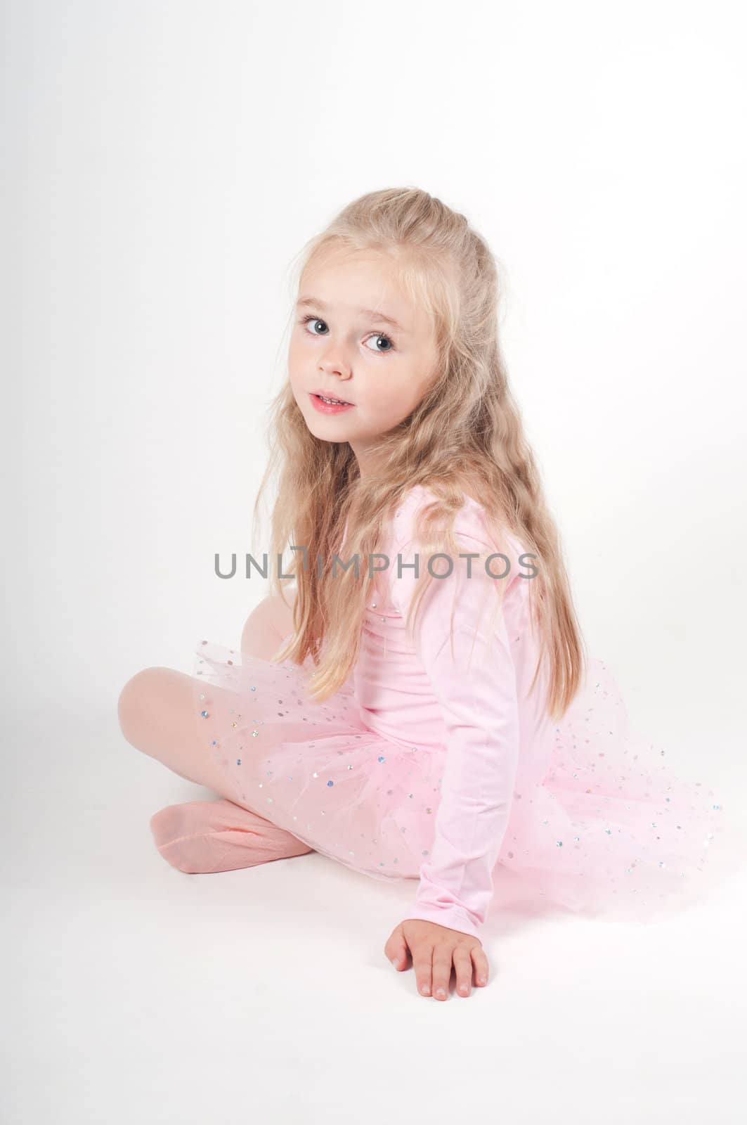 Studio shot of ballet dancer girl in pink