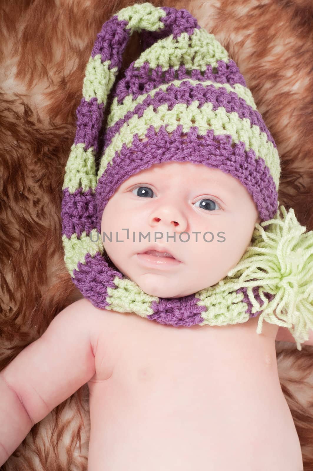 Shot of newborn baby lying on fur