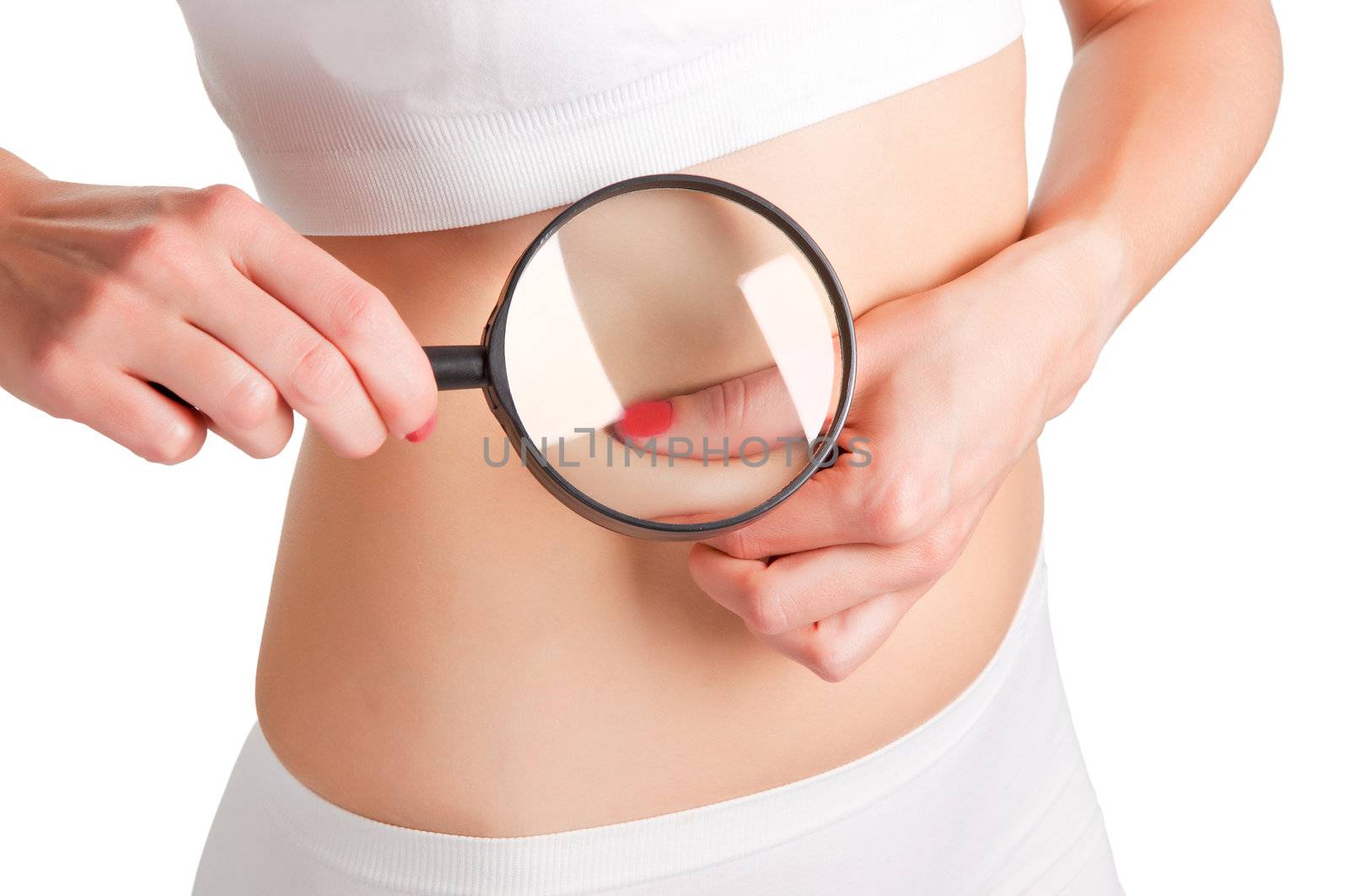 Woman pinching fat from her waist and examining it with a loupe