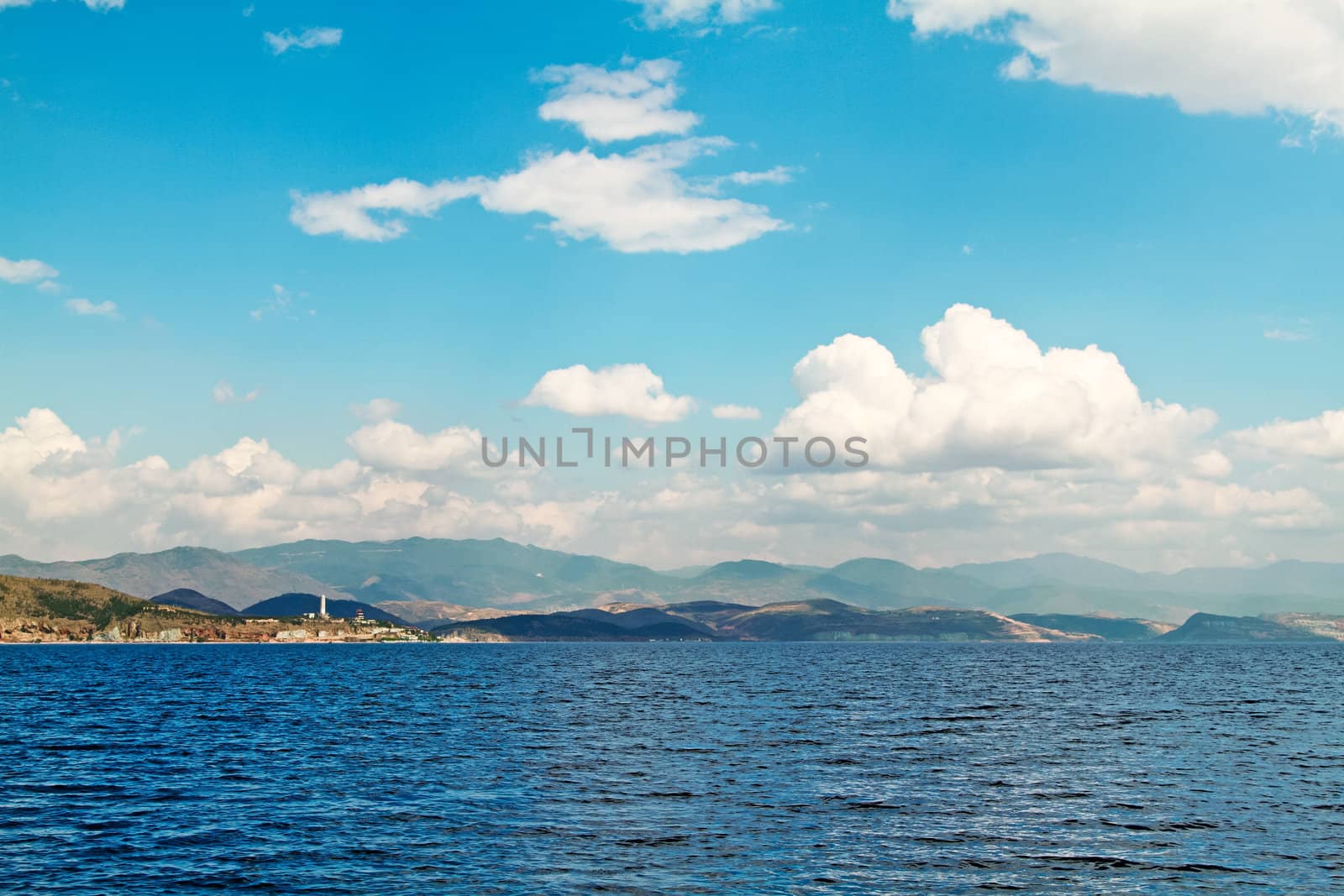 Lake mountain with clouds and blue sky