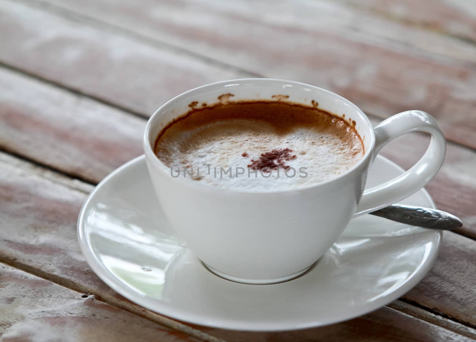 Coffee cup on wooden table