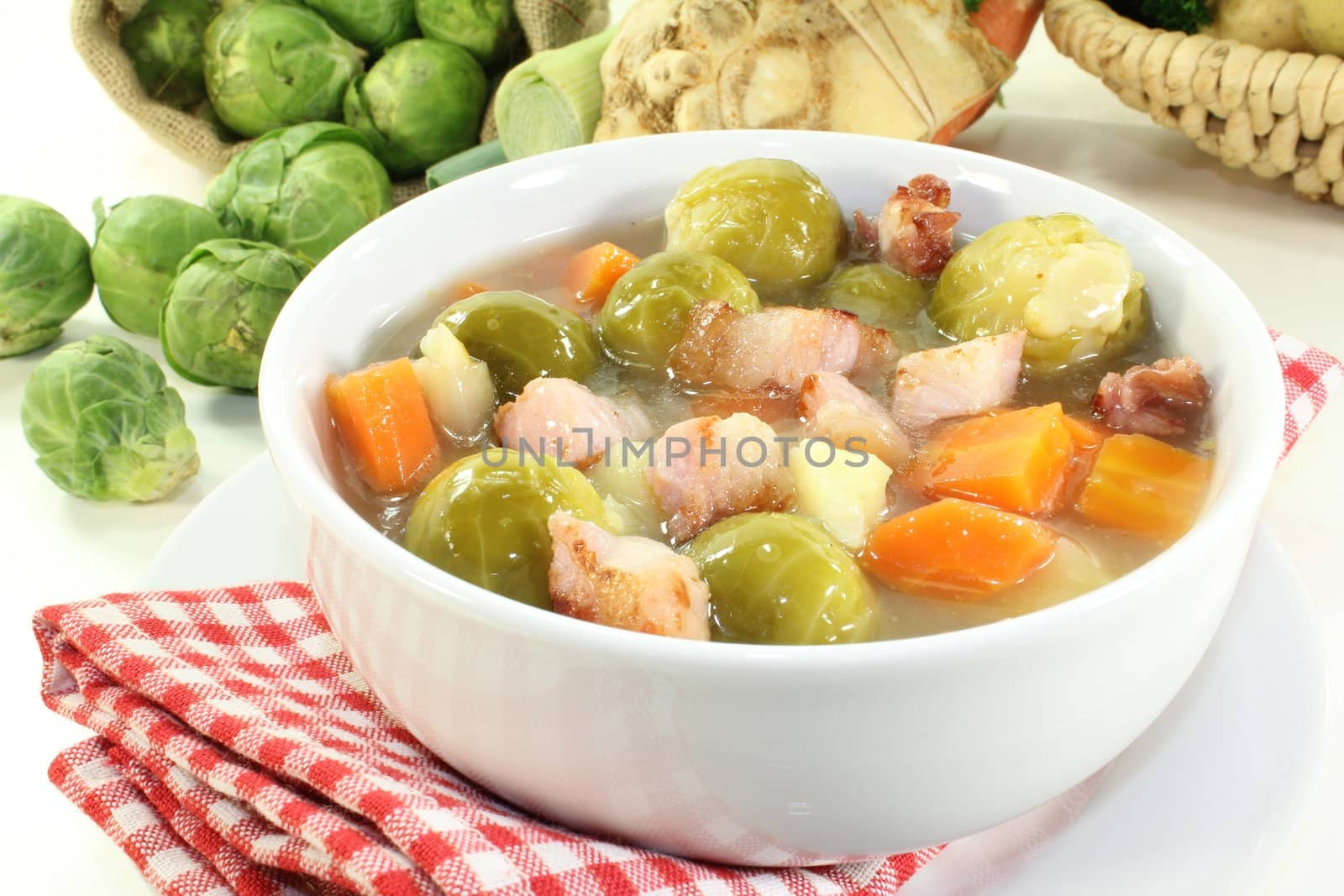 a bowl of Brussels sprouts stew with vegetables and bacon