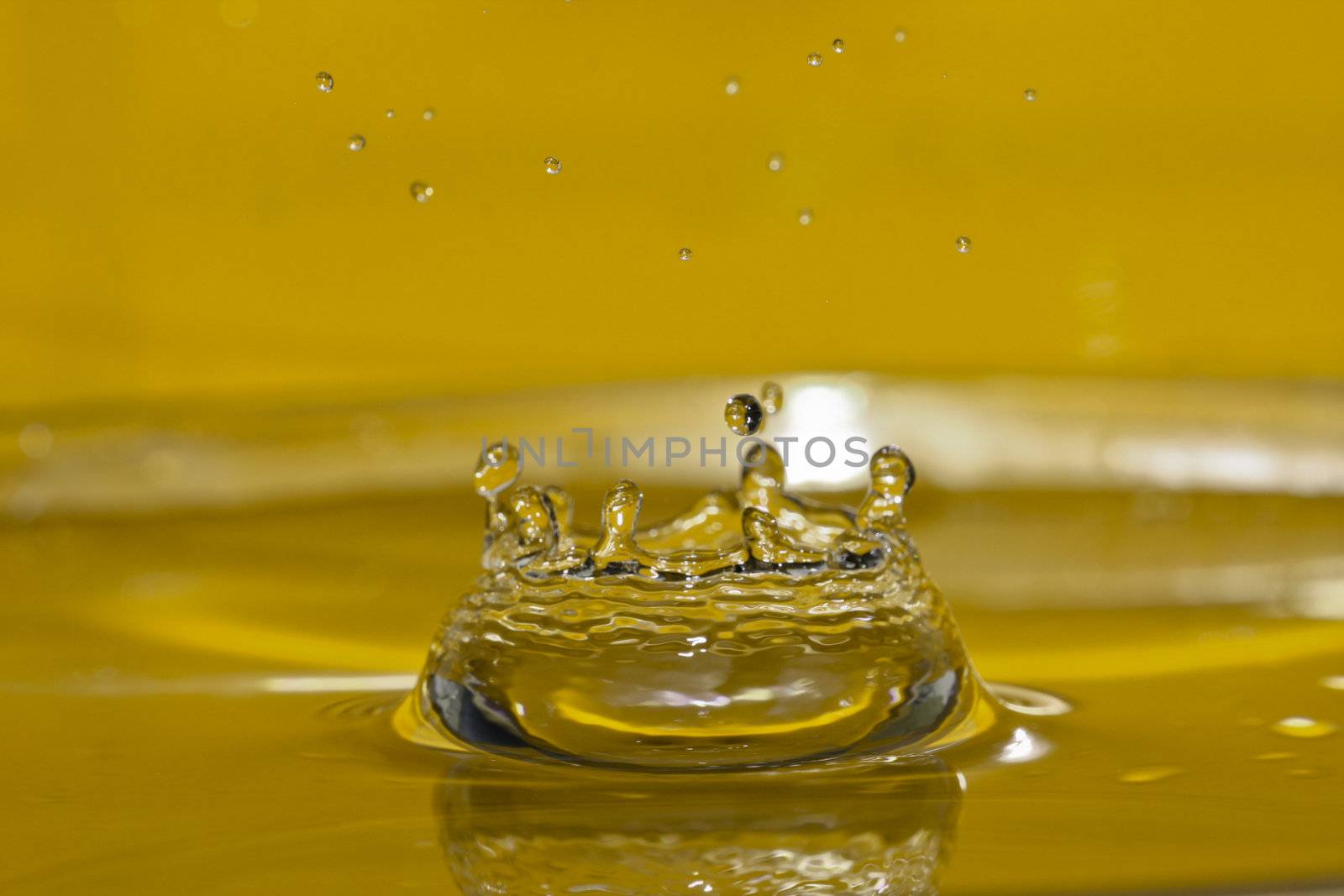 water splash isolated on yellow by chuckyq1