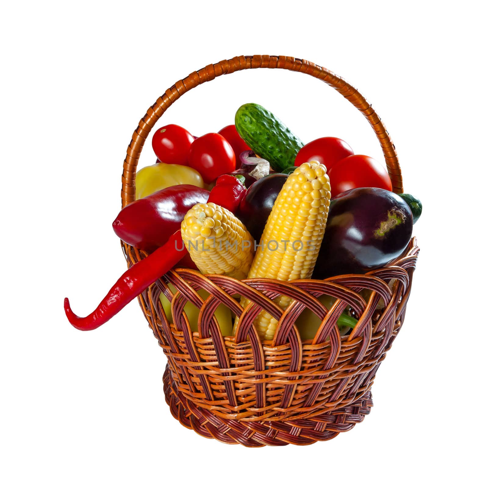 Different fresh vegetables in wicker basket isolated on a white background