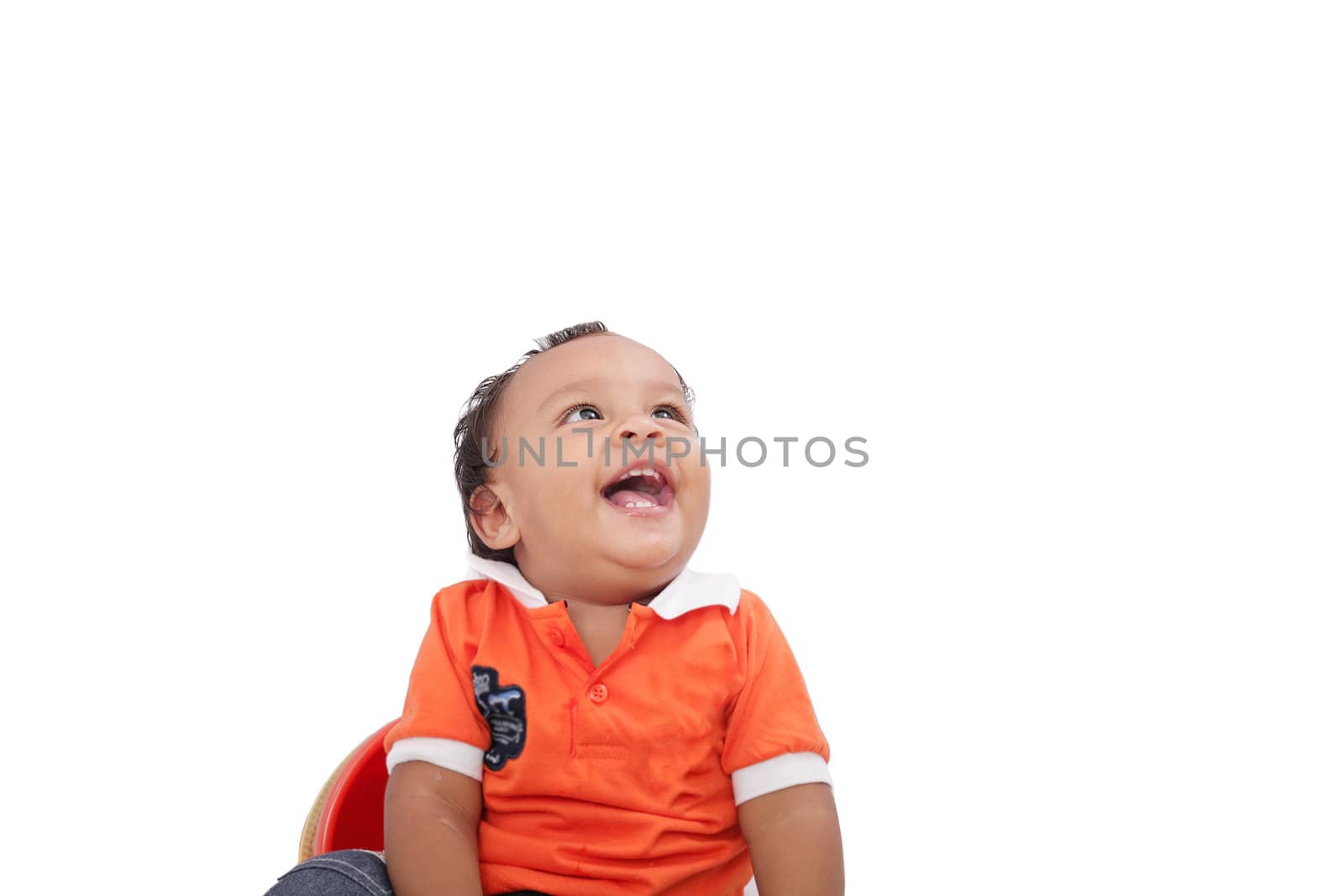 Baby laughing over white background. Active one year child by dacasdo