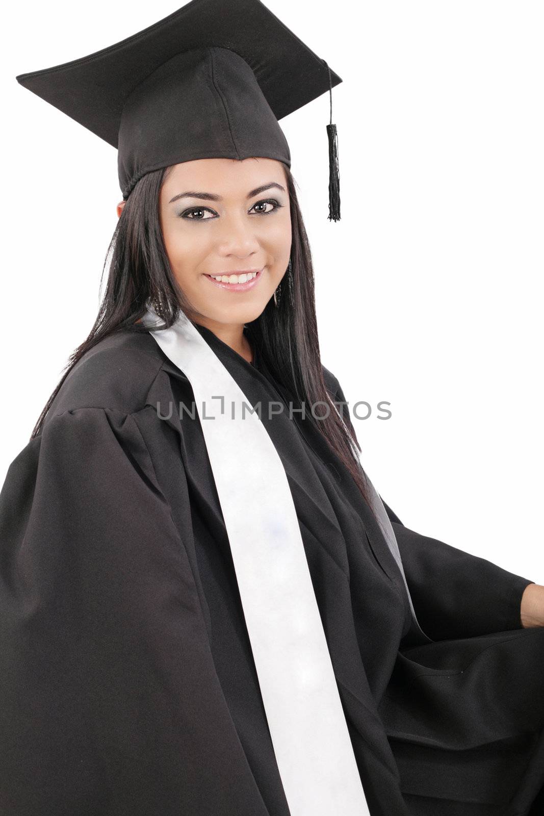 Female graduate wearing a gown and mortarboard - isolated over white