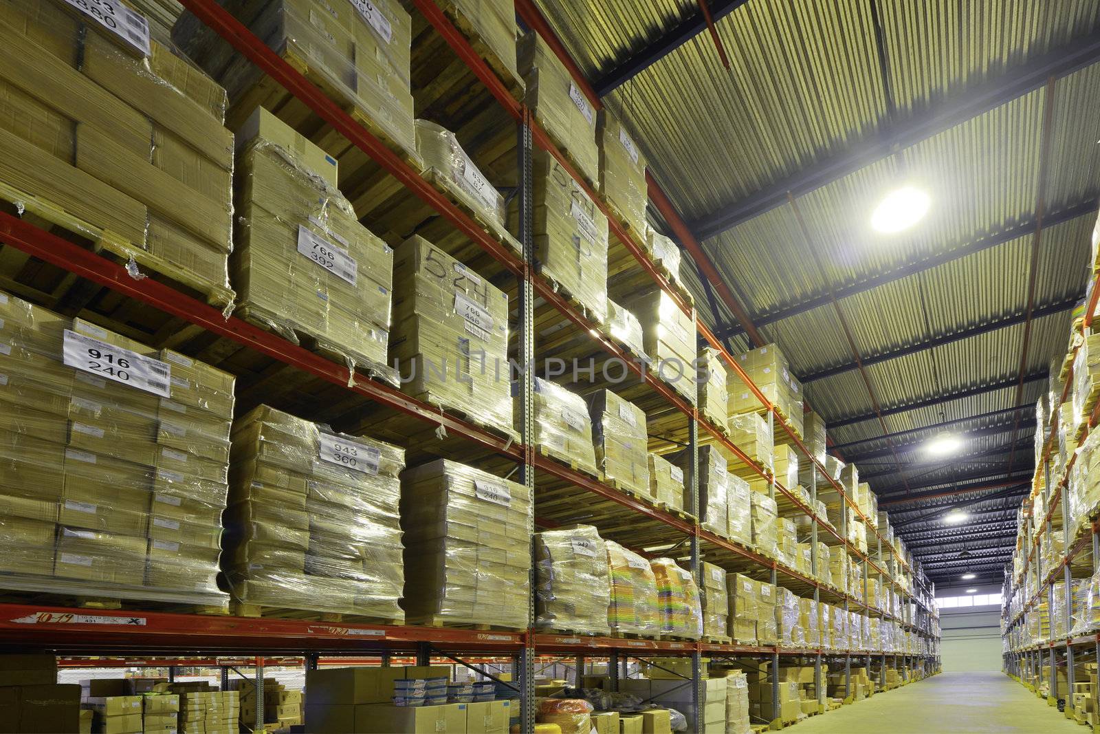 Indoor warehouse with lot of pallet. Wide angle photo.