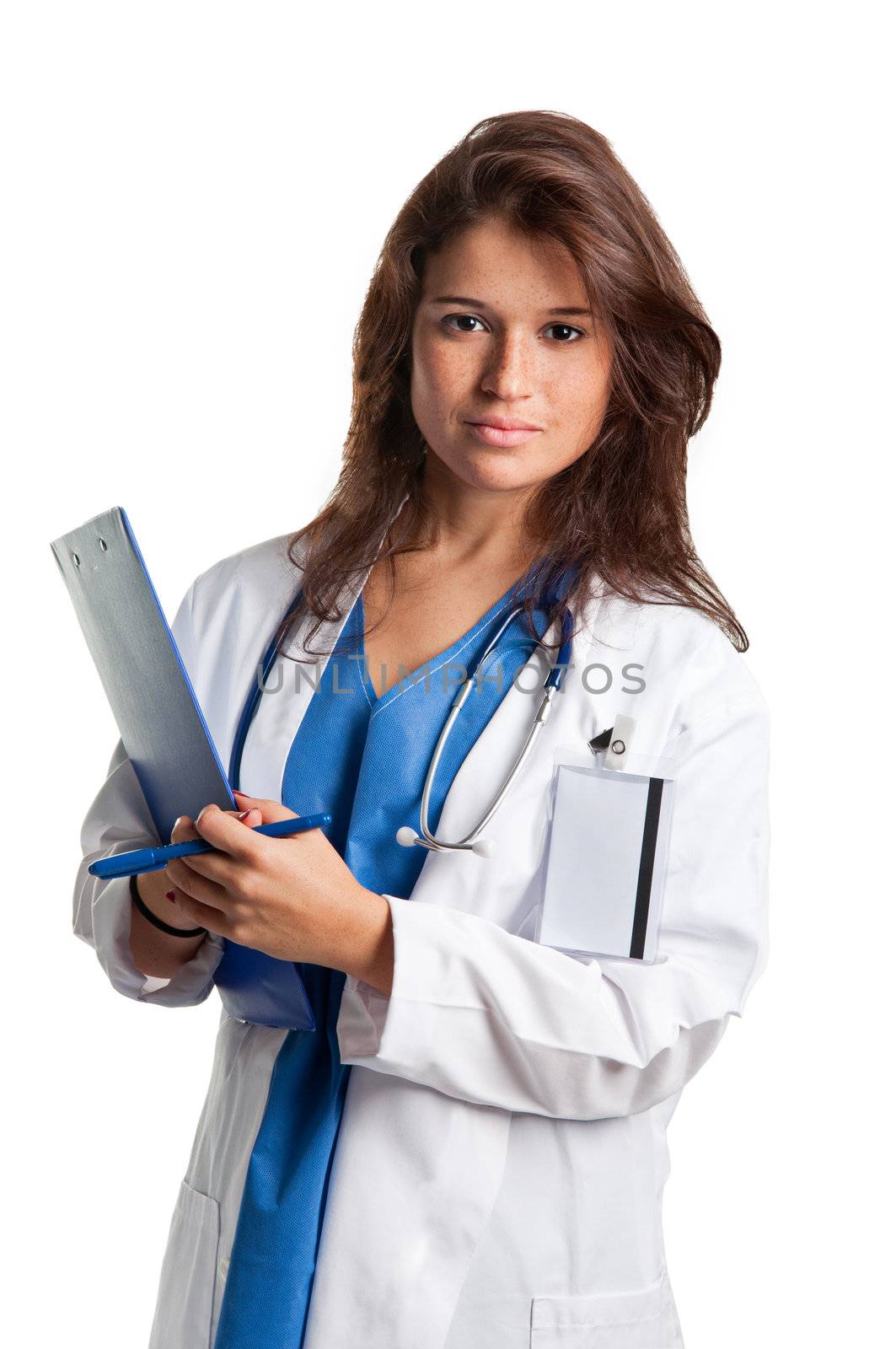 Young female doctor with scrubs and a stethoscope holding a notepad