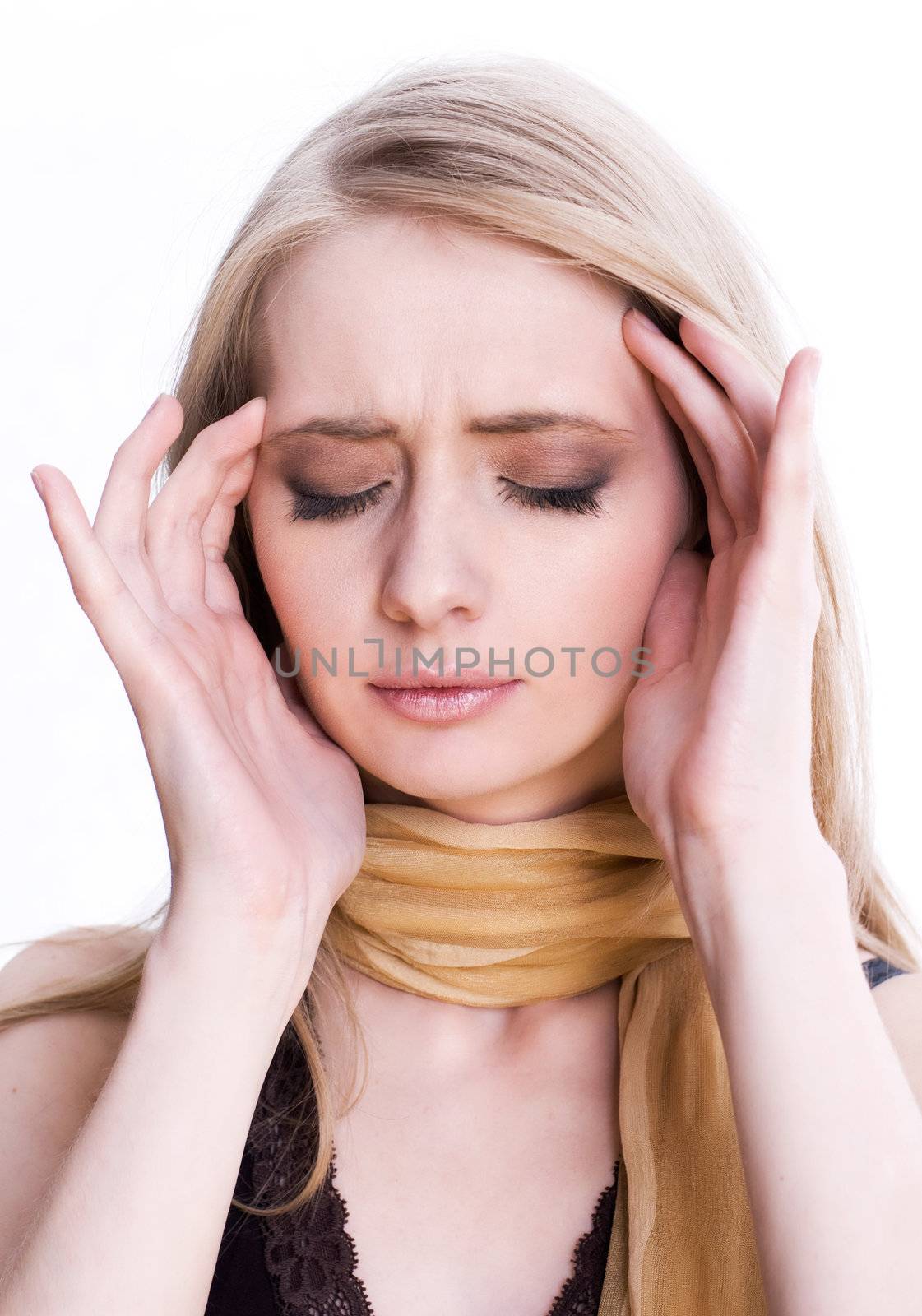 A blonde woman with head ache