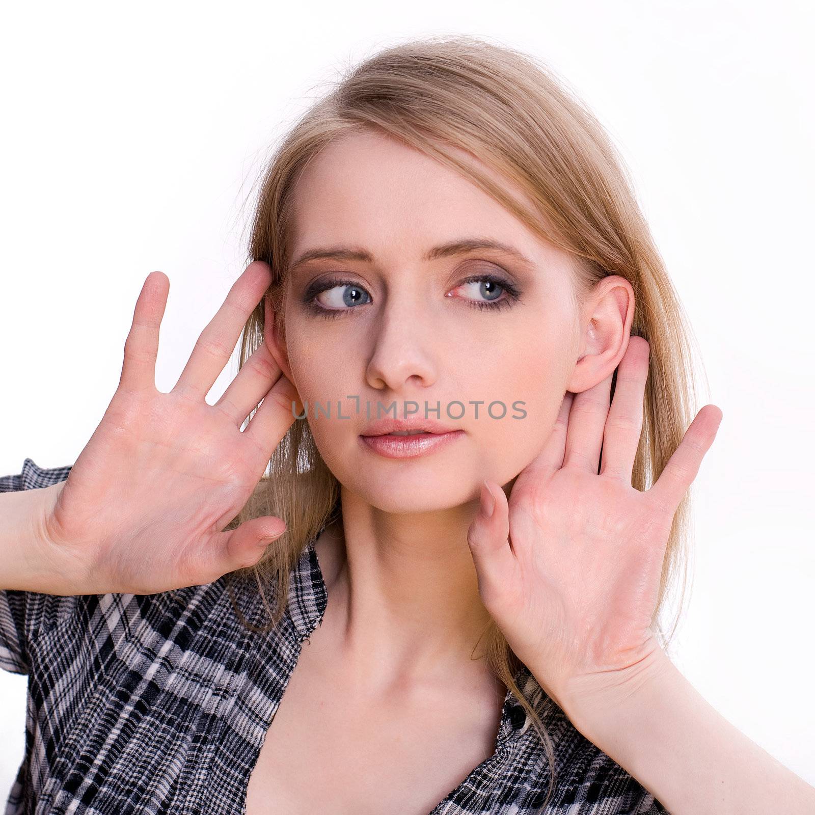 Young blonde woman listening to something gesture, isolated on white