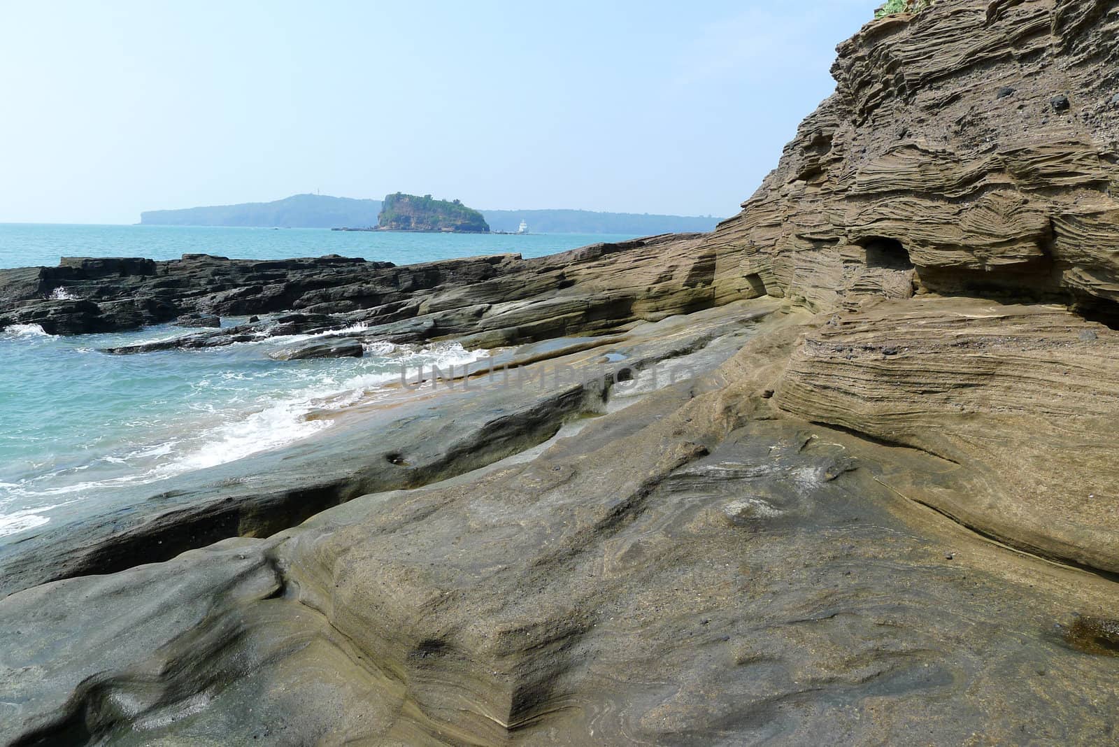 Landscape of seashore with huge rocks and blue water