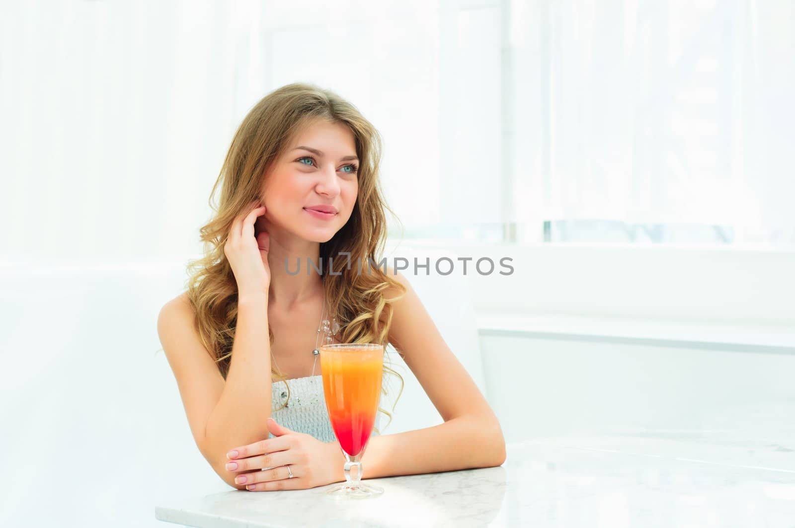 Portrait of a cute woman in urban cafe. drink beverage