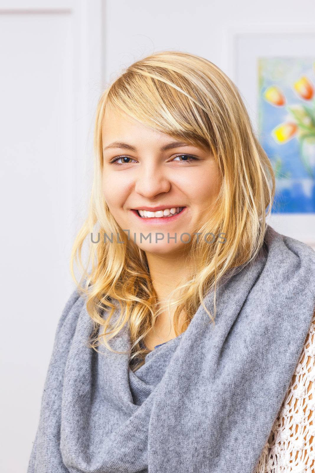 An image of a beautiful smiling blond girl