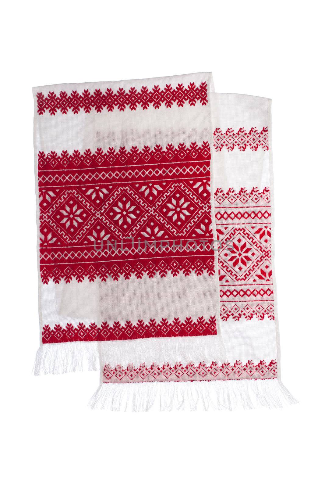 National Ukrainian traditional ornate craftsmanship symbol embroidery in red cross-stitch handmade white towel with ornamental pattern isolated