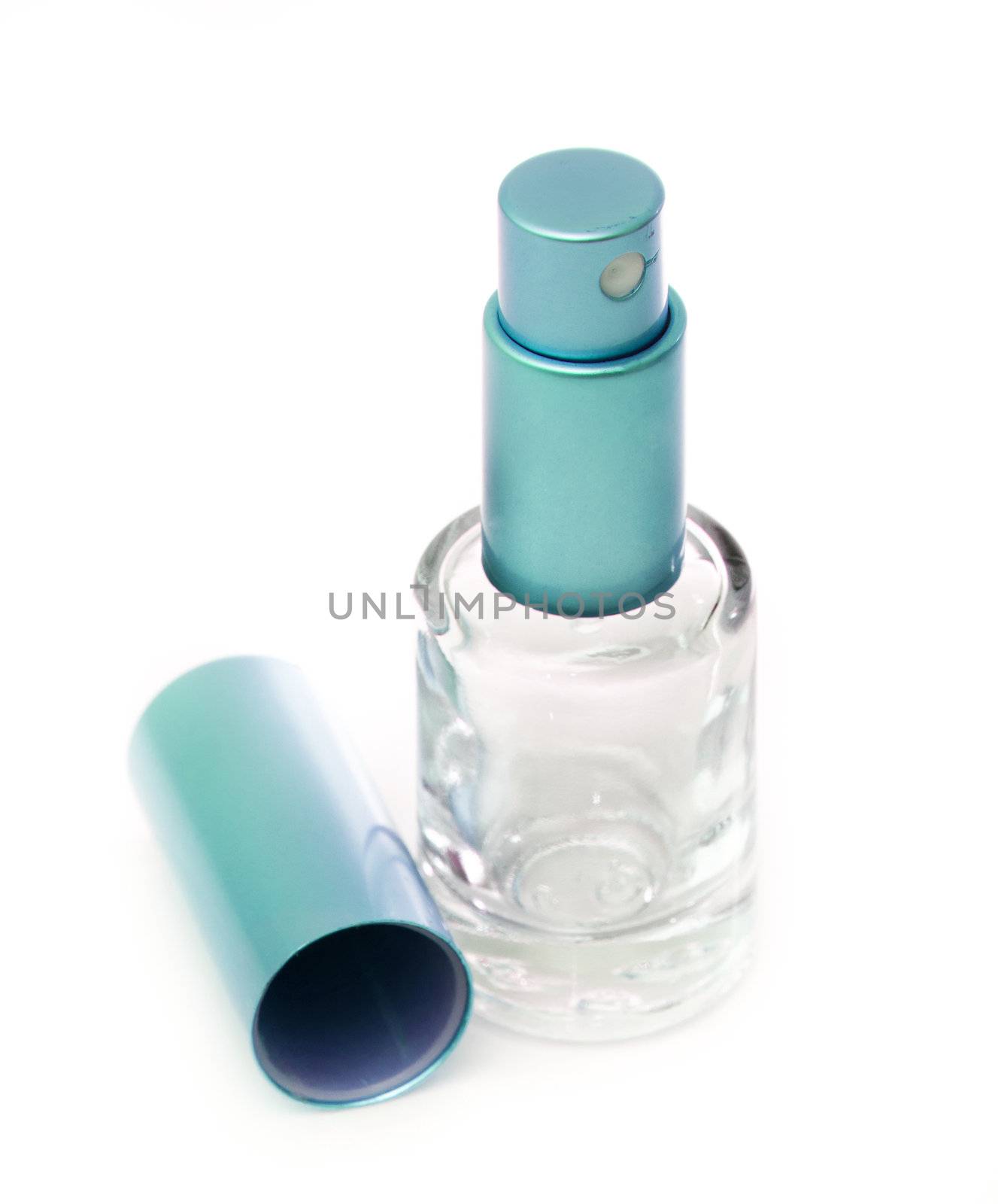 empty blue glass perfume bottle on a white backgroung
