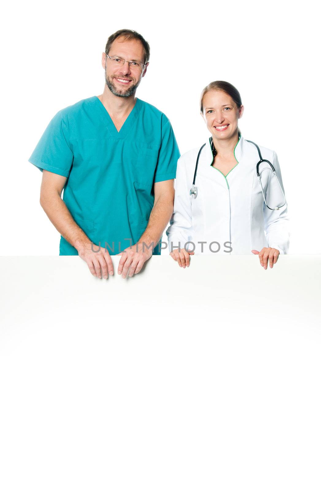 friendly doctors holding  a white blank board