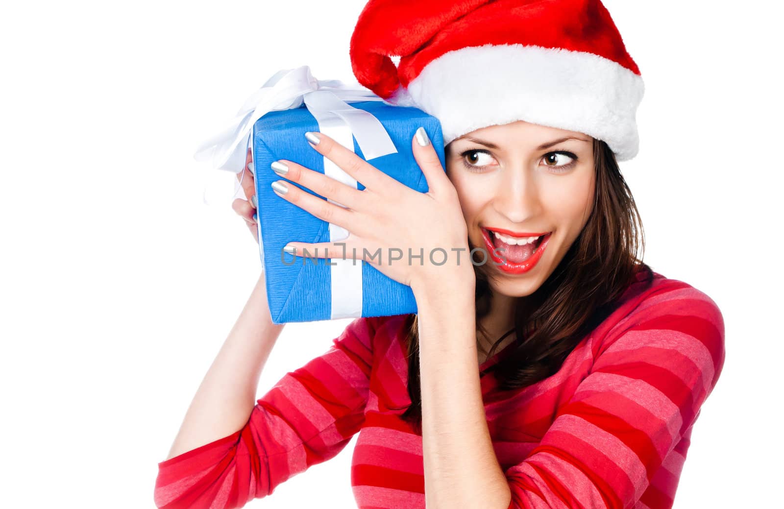 Beautiful girl in Santa hat with blue gift on a white