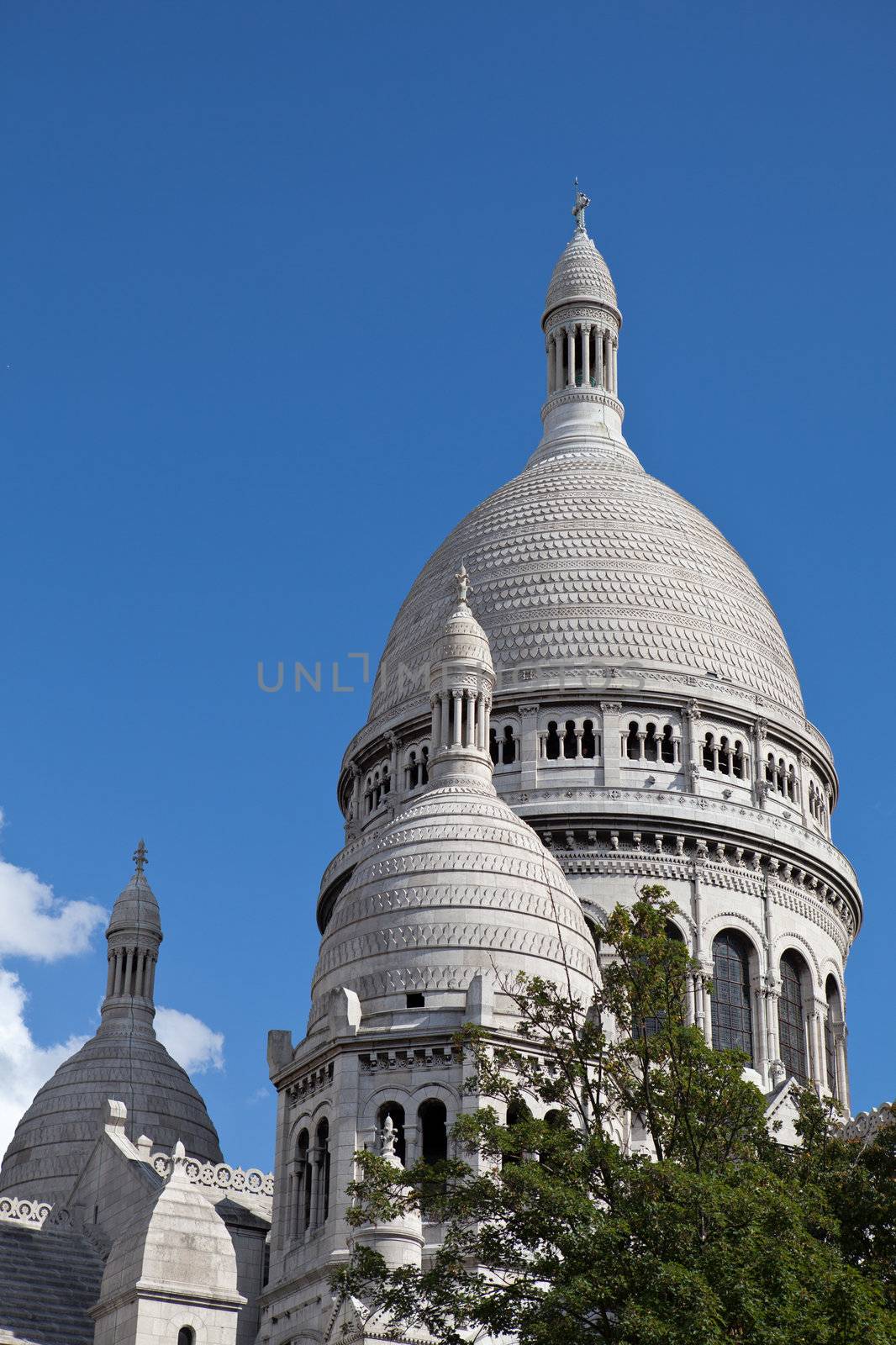 France Paris landmark Basilika Saint Heart on Montmartre Basilique du Sacré Cœur on the blue sky background