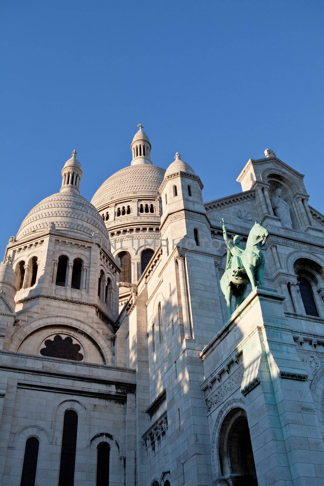 France Paris landmark Basilika Saint Heart on Montmartre Basilique du Sacré Cœur on the blue sky background