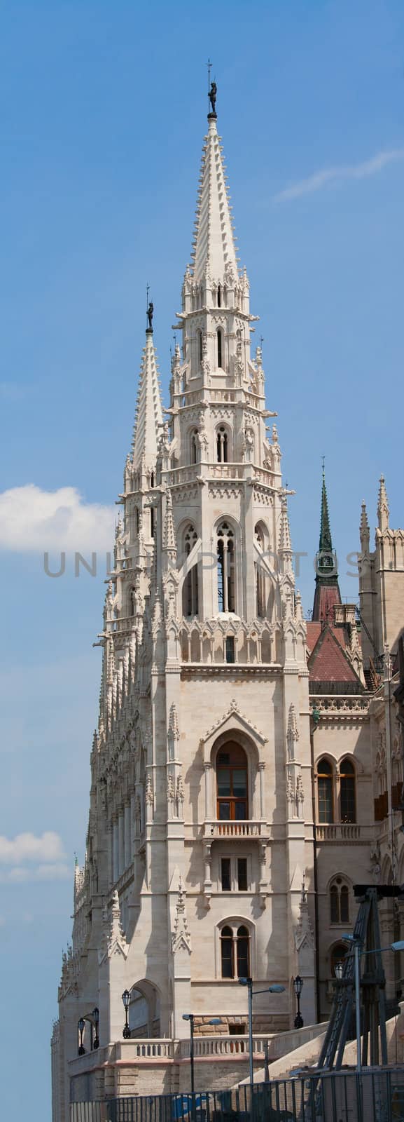 Panoramic steeple gothic revival style towers of Hungariuan governmant landmark Parliament by Imre Steindl in Budapest on blue sky background