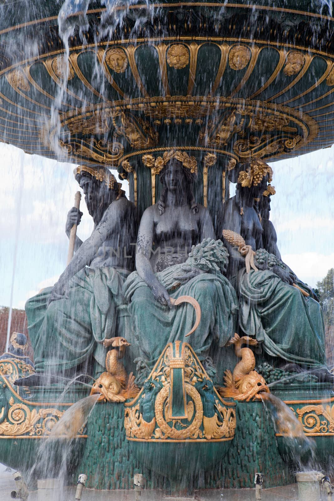 Landmark famous sculptural fountain of River Commerce and Navigation on the Place de la Concorde in Paris France on the cloudy sky background