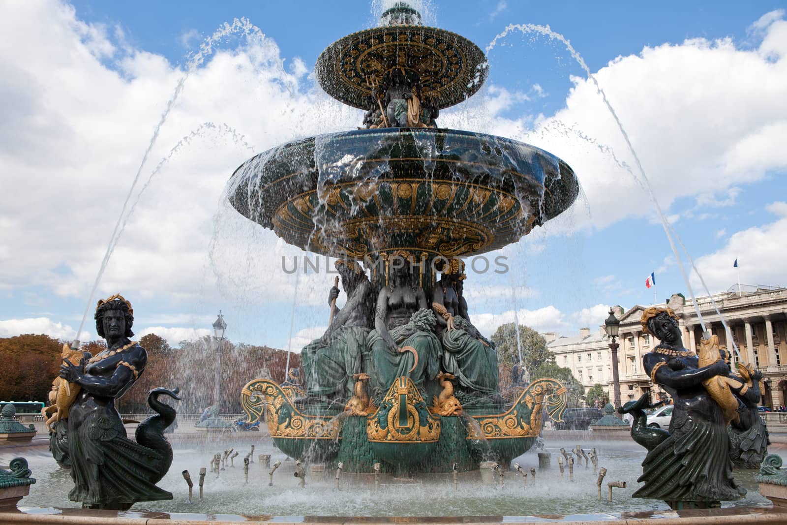Landmark famous sculptural fountain of River Commerce and Navigation on the Place de la Concorde in Paris France on the cloudy sky background
