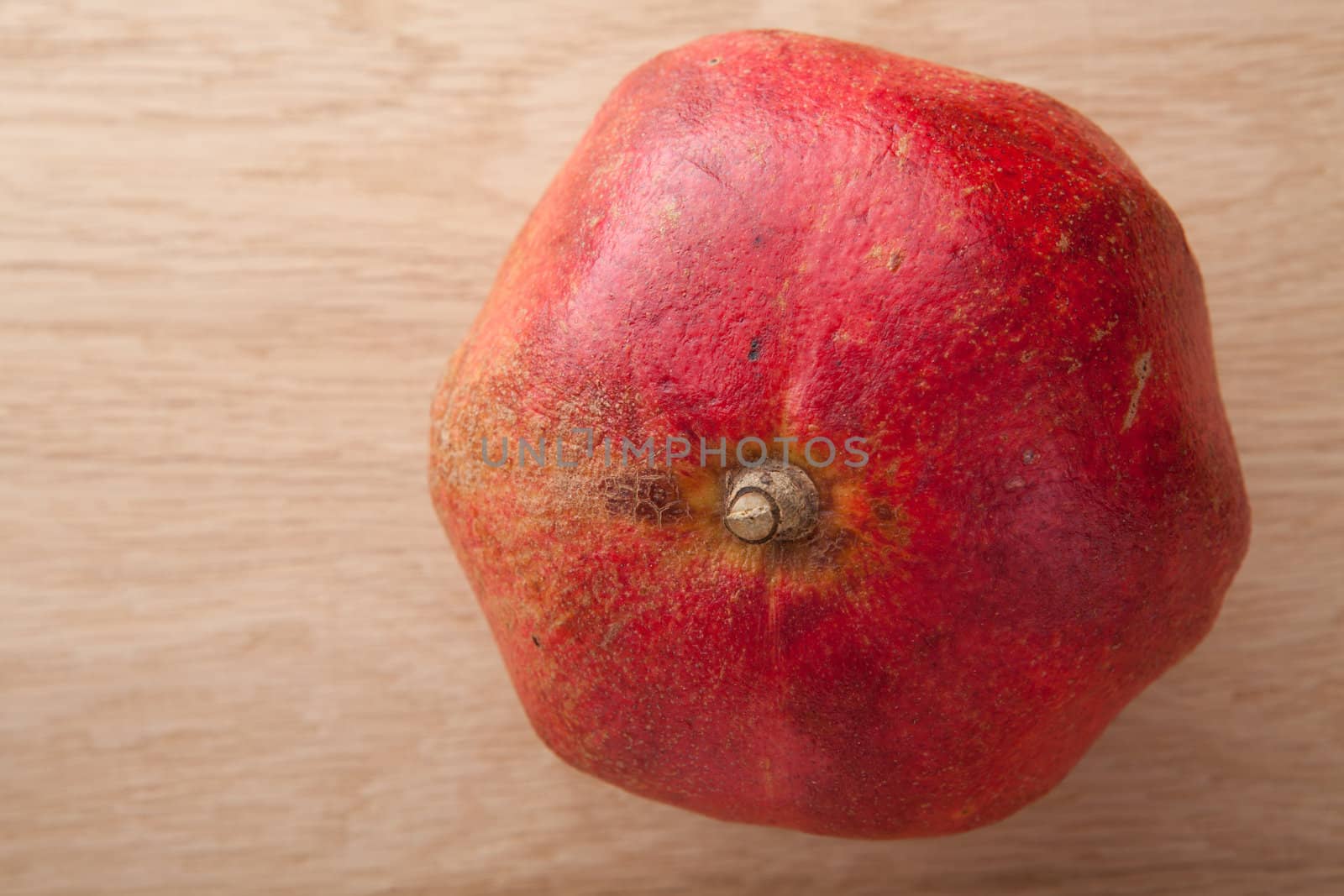 Dried pomegranate on wooden background