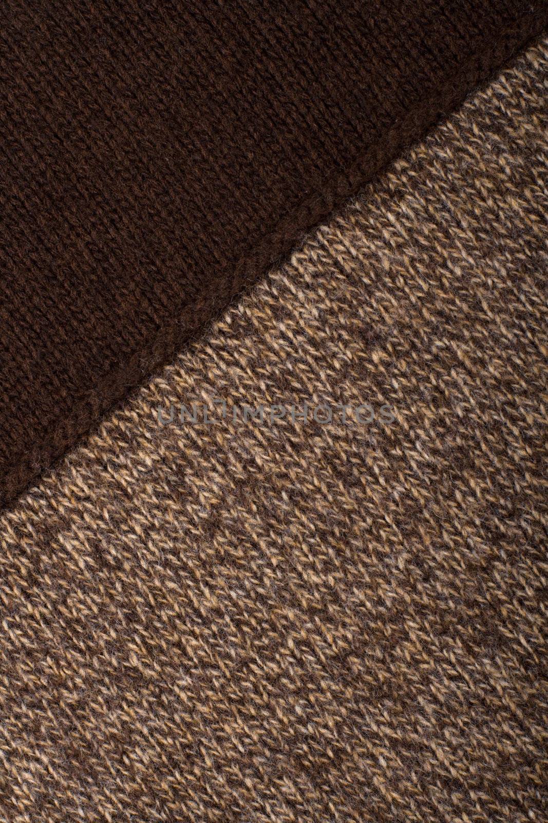 Knitted textile from two dark brown and speckled patterns Backgrounds Abstract