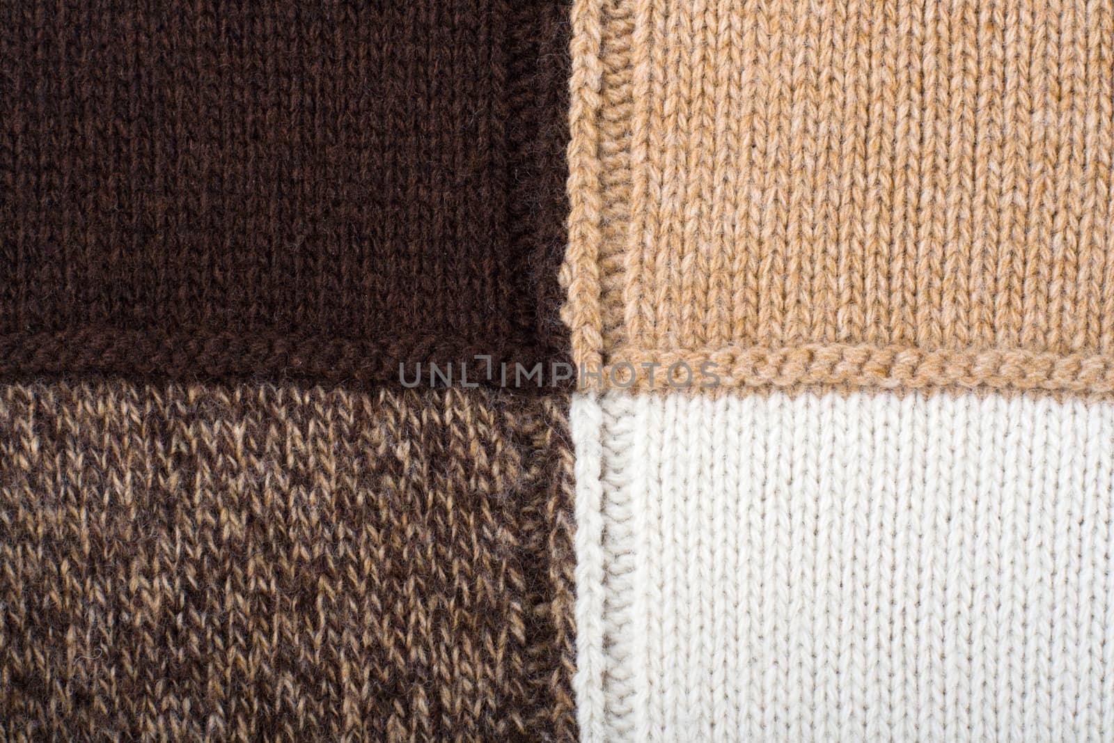 Knitted textile from four beige, white, brown and speckled brown patterns Backgrounds Abstract