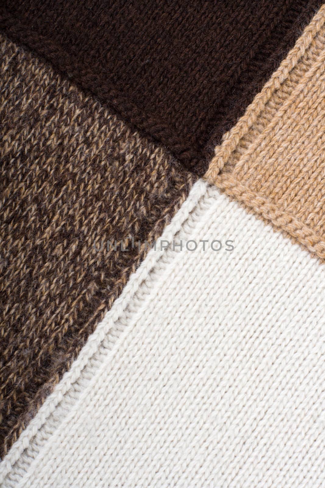 Knitted textile from four beige, white, brown and speckled brown patterns Backgrounds Abstract