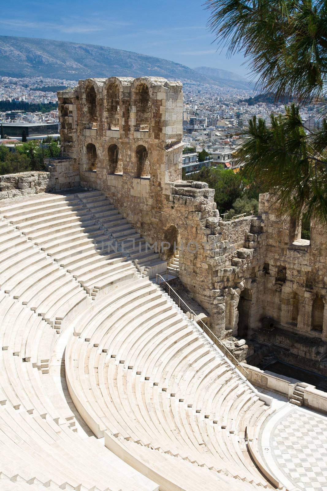 Ancient amphiteatr Odeon Gerodes Atticus in Acropol Greece with Athens city view