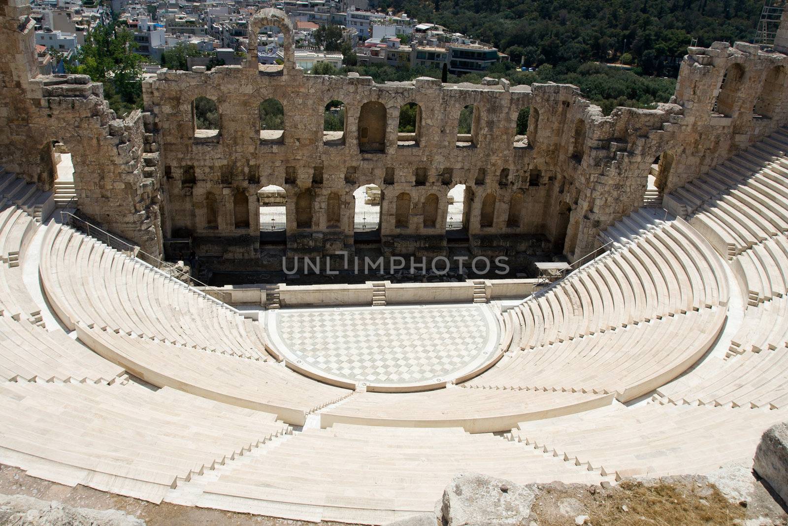 Ancient amphiteatr Odeon Gerodes Atticus in Acropol Greece with Athens city view