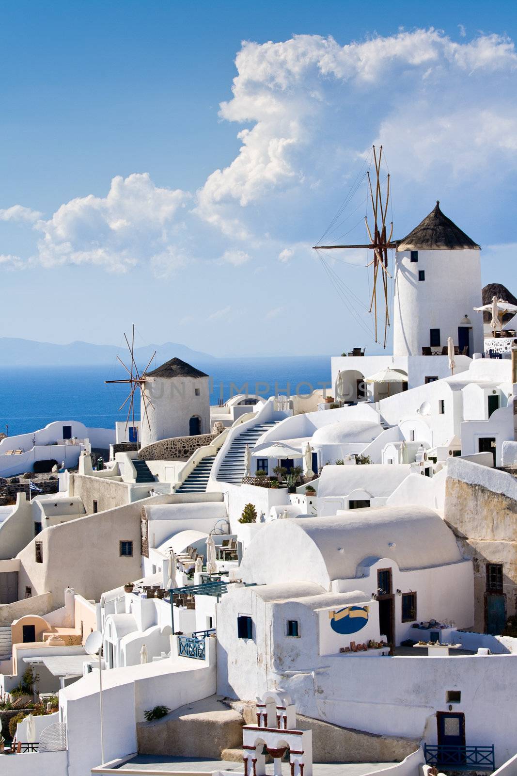 Traditional windmills in village Oia of Cyclades island Santorin by SergeyAK