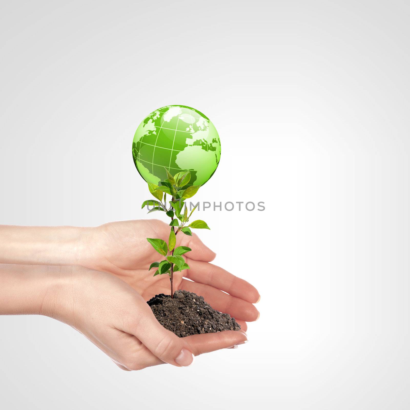 Globe in human hand against blue sky. Environmental protection concept. Elements of this image furnished by NASA