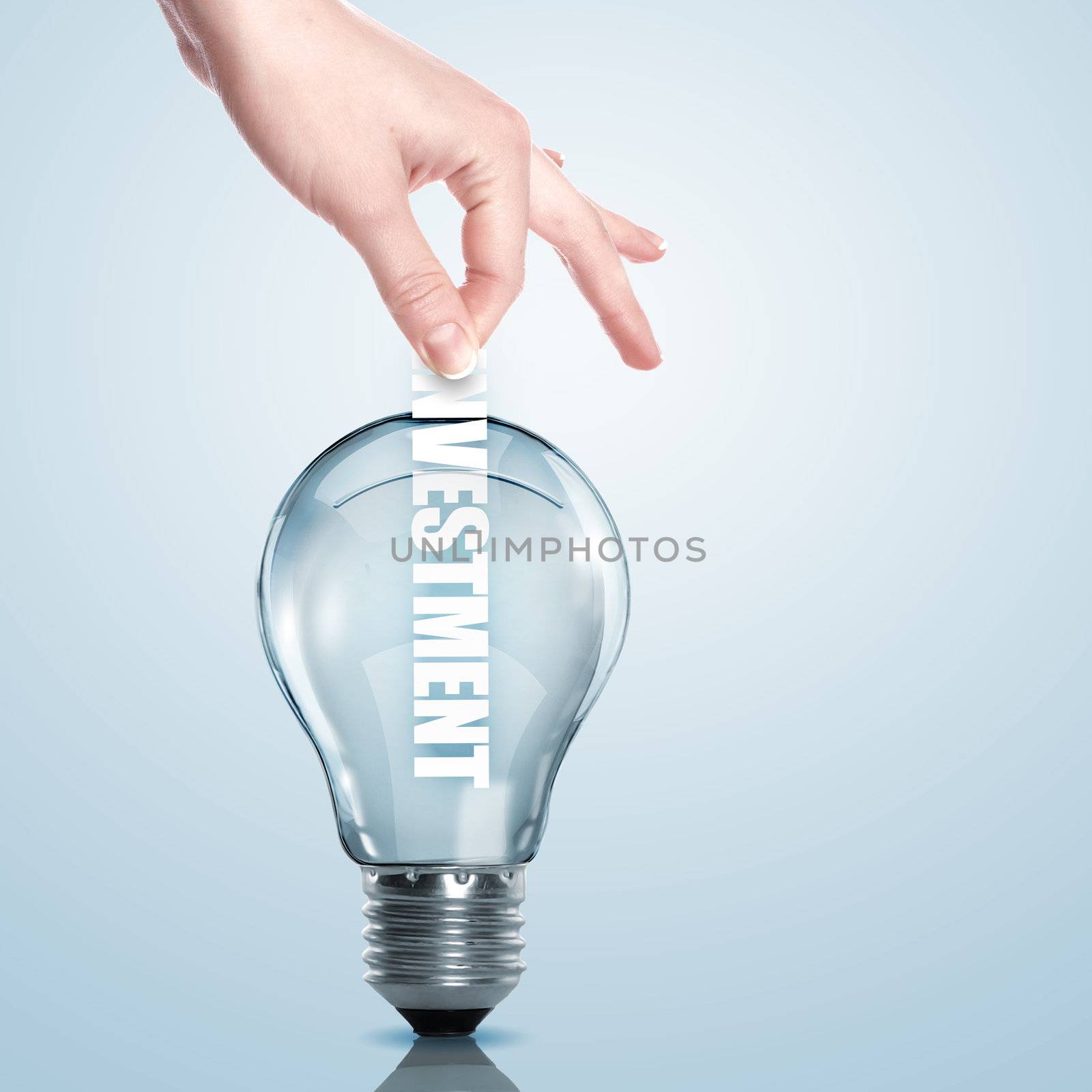 Hand putting a busines term into a light bulb